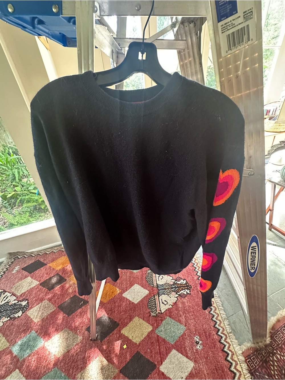 Brodie Cashmere Black Crewneck Sweater with Pink and Orange Heart Sleeves